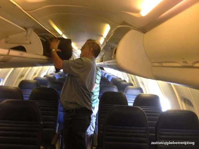 Tips for Flying with Autism on CRJ -700 Planes overhead bin